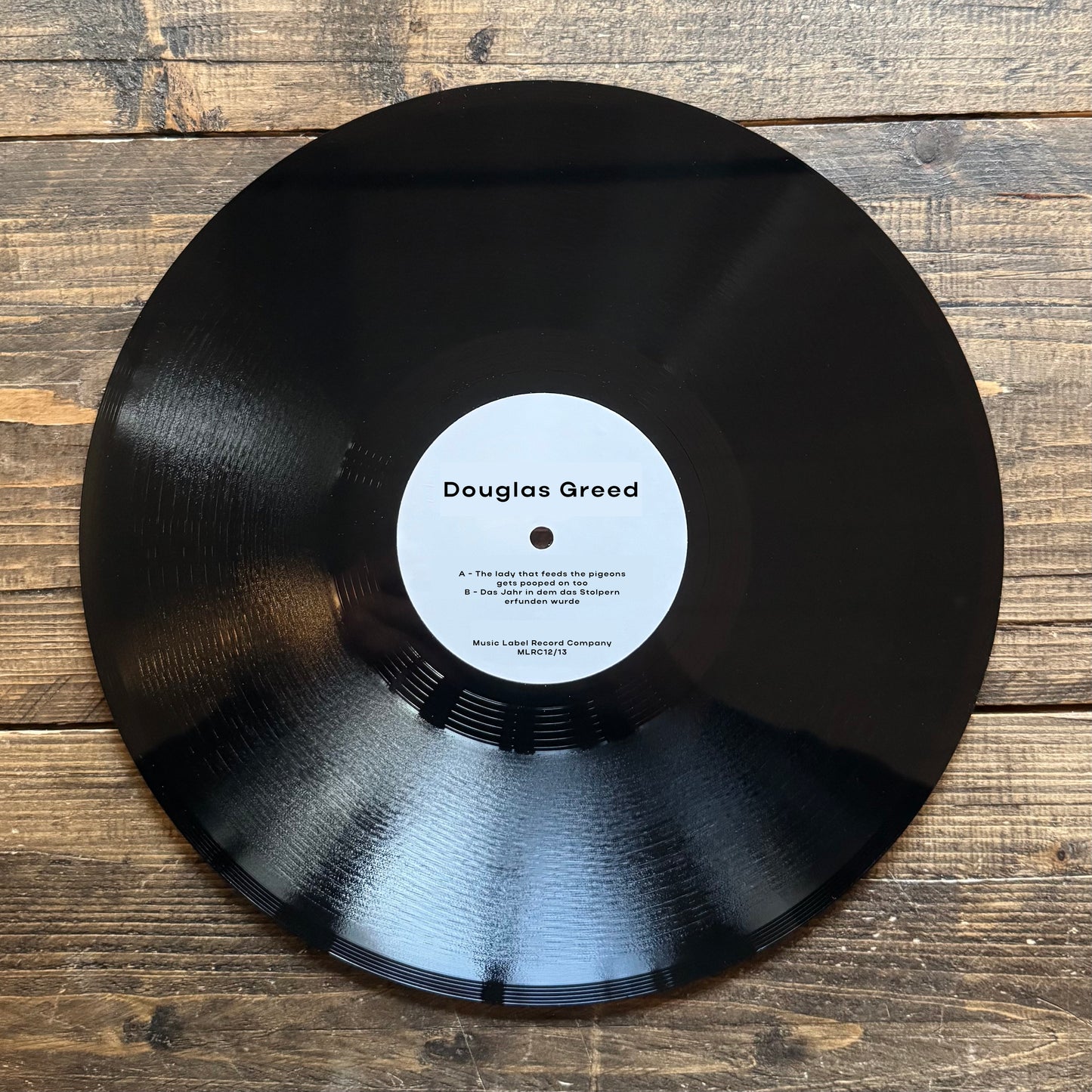 Douglas Greed "The lady that feeds the pigeon gets pooped on too / 13 - Das Jahr in dem das Stolpern erfunden wurdet" (MLRC12/13)